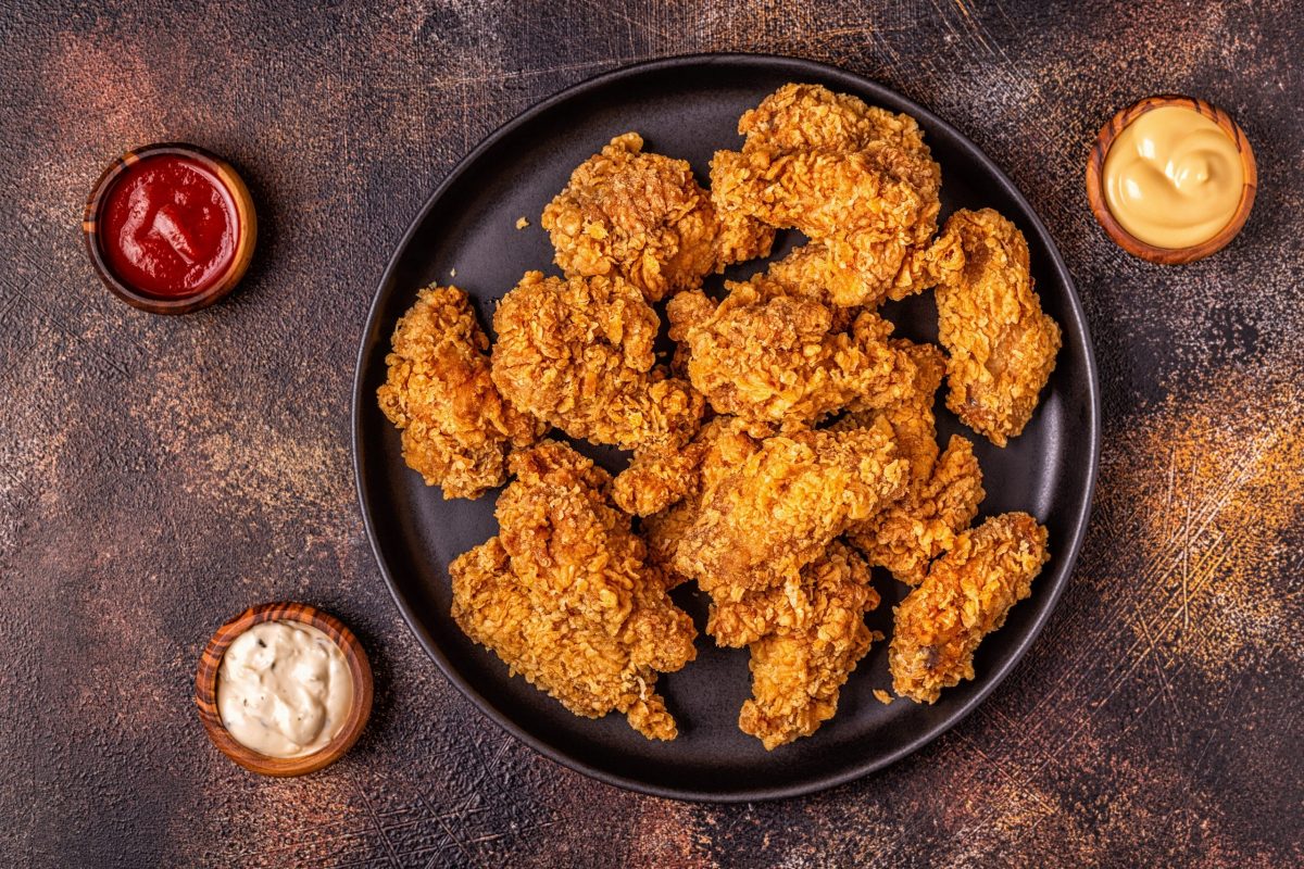 Fried chicken wings with various sauces.