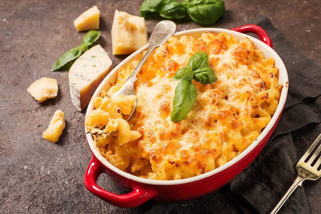 Mac and cheese, american style macaroni pasta in cheesy sauce