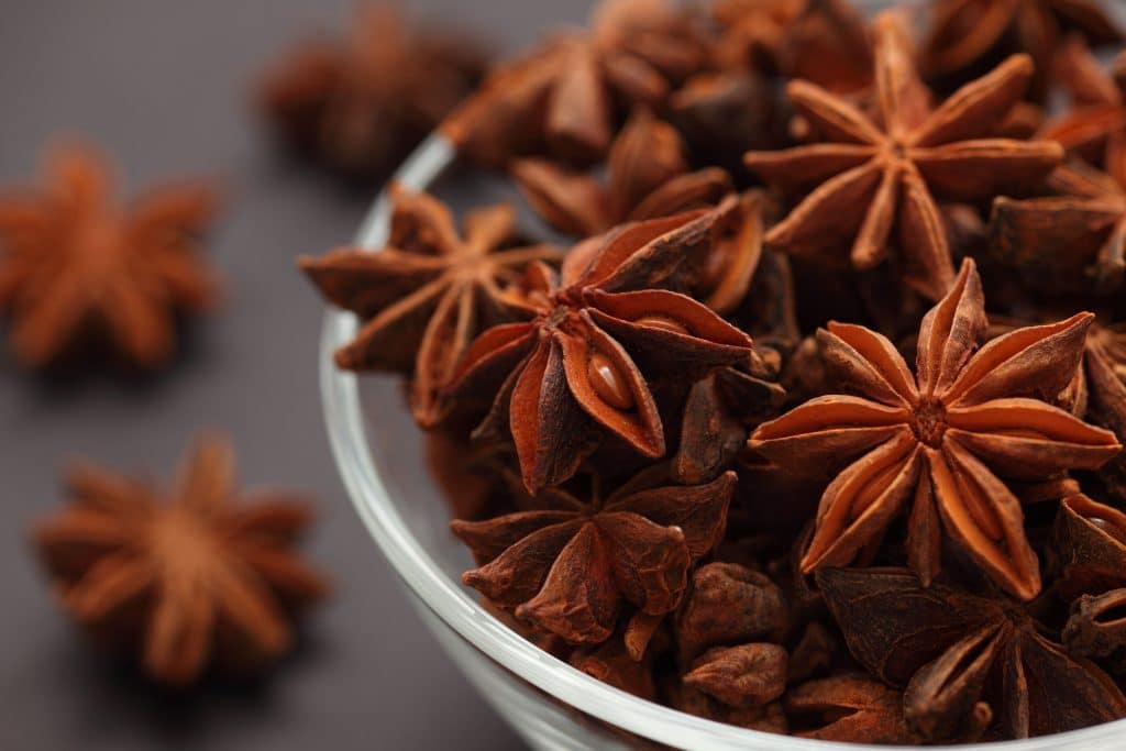 Star anise in a glass bowl. Close-up.