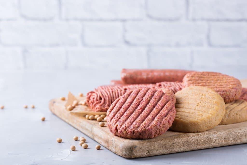 Assortment of plant based meat on a table. Food to reduce carbon footprint, sustainable consumption